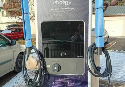 Electric vehicle charging point at the station entrance